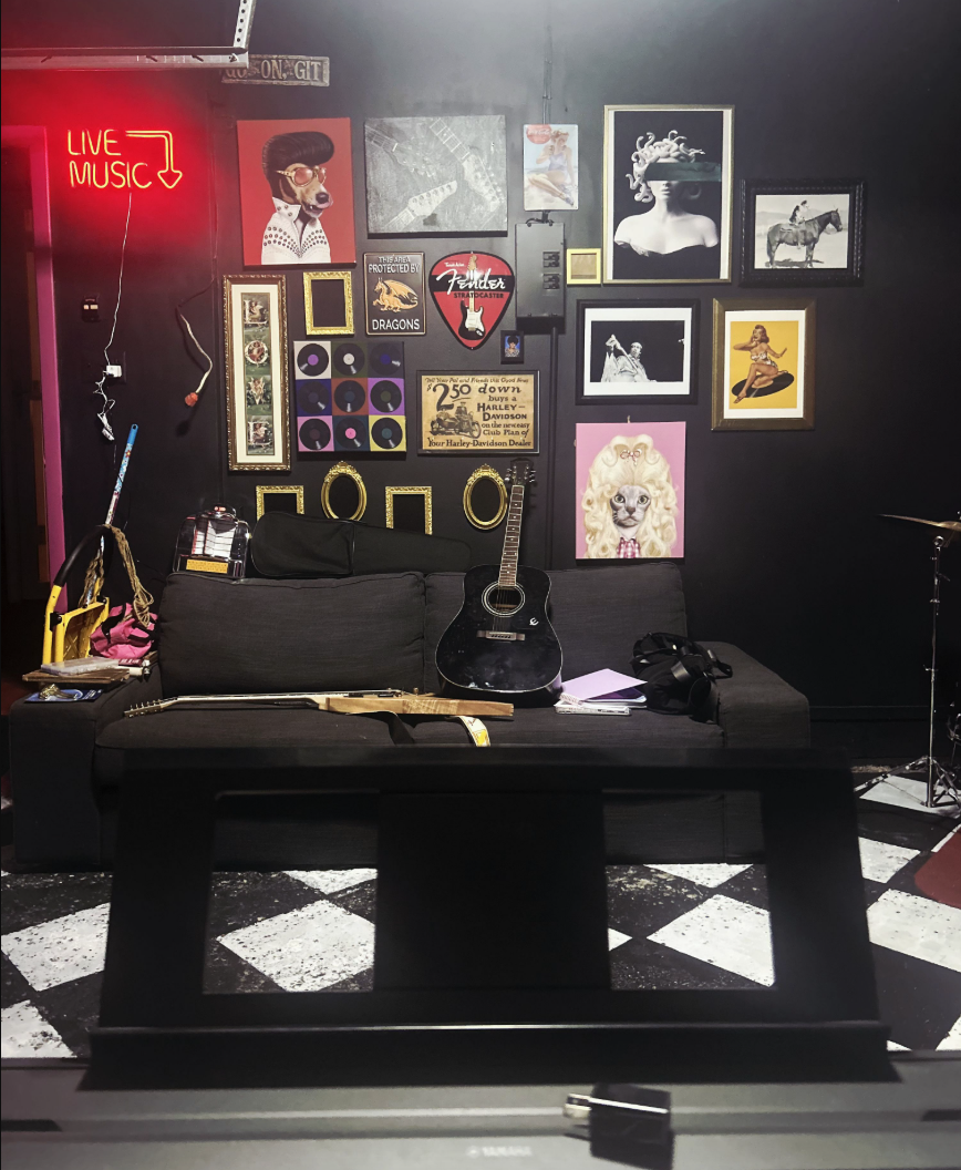 Miss Olivia's music studio with memorabilia, neon signs, and instruments